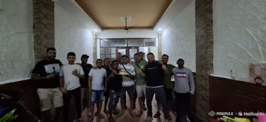 Friends Celebrate with Kungfu Moves in Cozy Room – AI Generated Video | Hailuo AI