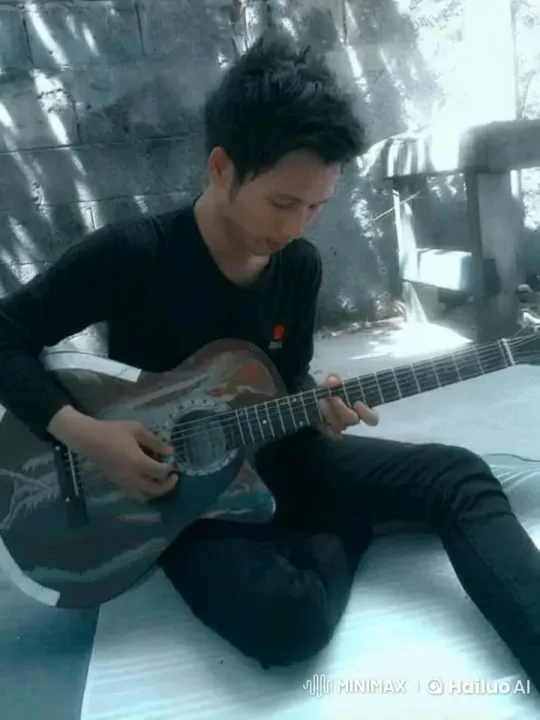 Young Man Plays 'Bintang di Surga' on Guitar Outdoors – AI Generated Video | Hailuo AI