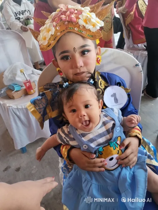 Traditional Celebration with Baby in Cheerful Attire – AI Generated Video | Hailuo AI