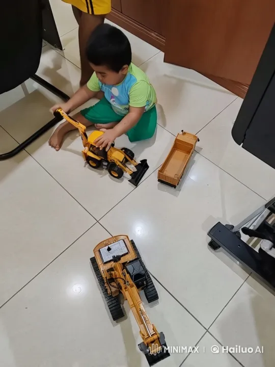 Child Playing with Toy Construction Vehicles Indoors – AI Generated Video | Hailuo AI