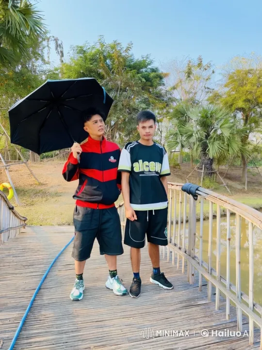 Kung Fu Fight on Wooden Bridge Amidst Serene Pond – AI Generated Video | Hailuo AI