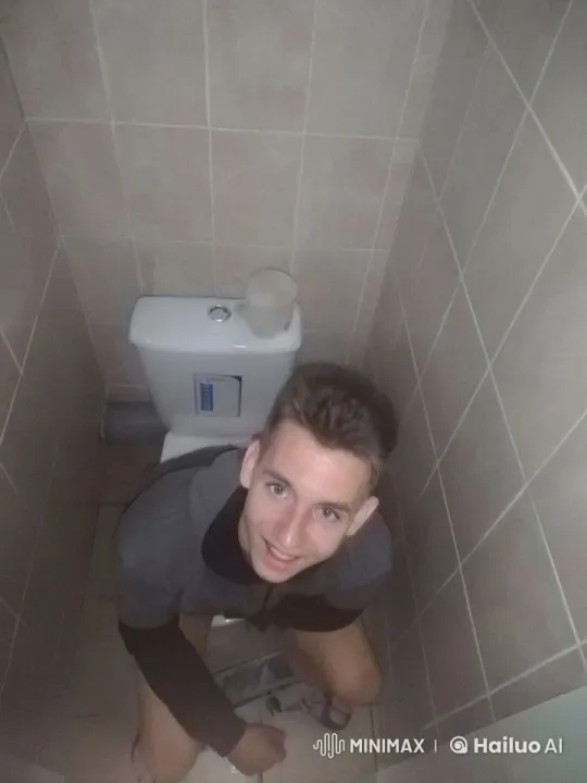 Individual on Toilet in Small Bathroom – AI Generated Video | Hailuo AI