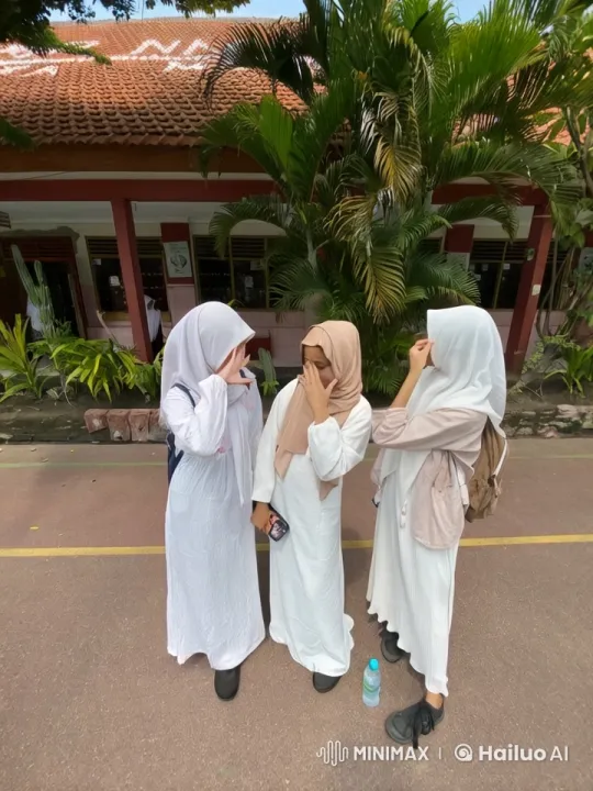 Schoolyard Friendship: Young Women Chatting in Abayas – AI Generated Video | Hailuo AI