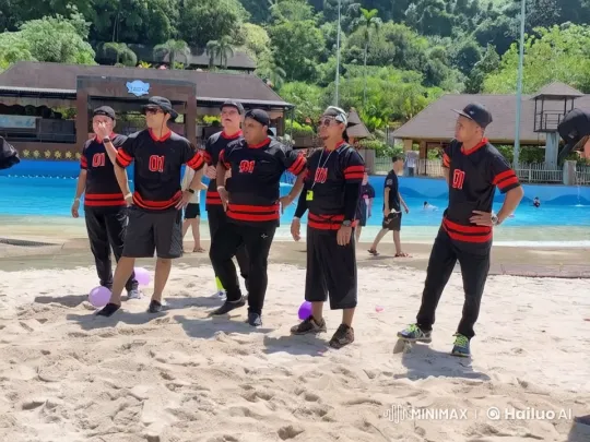 Six Men in Black Jerseys Prepare on Beachfront – AI Generated Video | Hailuo AI