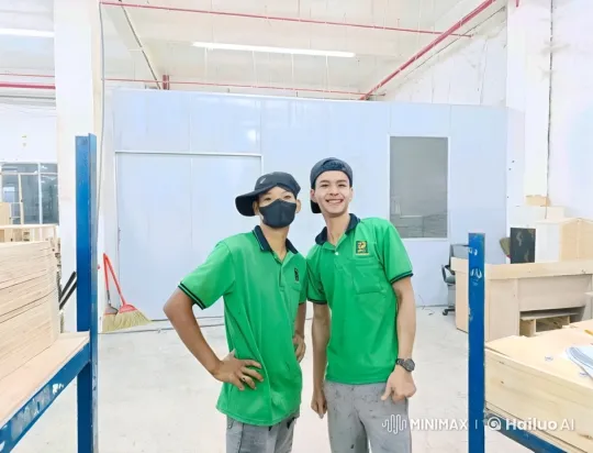 Two Men in Workshop Pose for Video – AI Generated Video | Hailuo AI