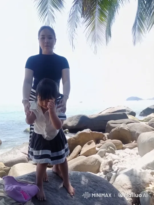 Family Bonding on Tranquil Beach Rock – AI Generated Video | Hailuo AI