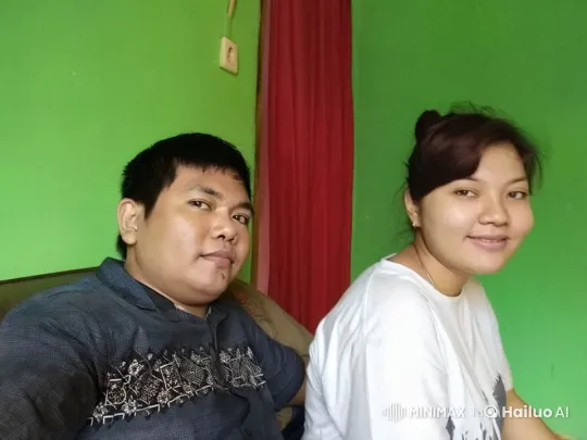 Affectionate Moment on a Cozy Green-Colored Couch – AI Generated Video | Hailuo AI