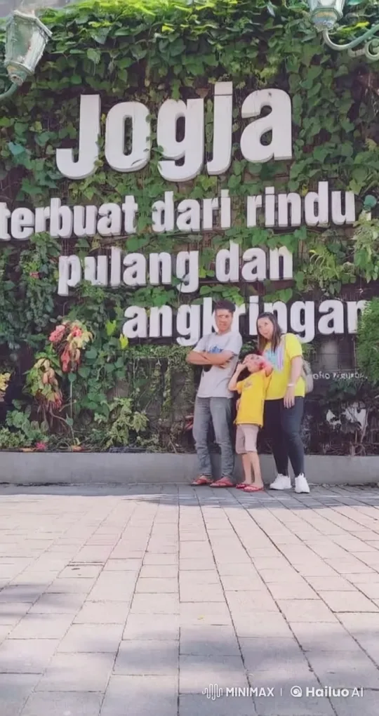 Family Enjoys Playful Kungfu Pose in Front of Green Wall – AI Generated Video | Hailuo AI