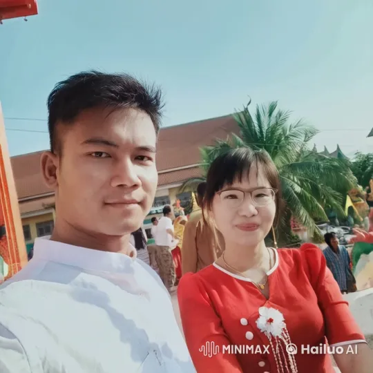 Couple Takes Selfie at Festive Outdoor Event with Kungfu Performers – AI Generated Video | Hailuo AI