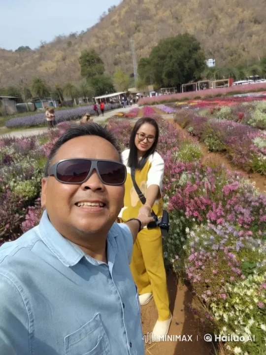 Couple Practicing Kungfu in Colorful Garden with Mountains – AI Generated Video | Hailuo AI