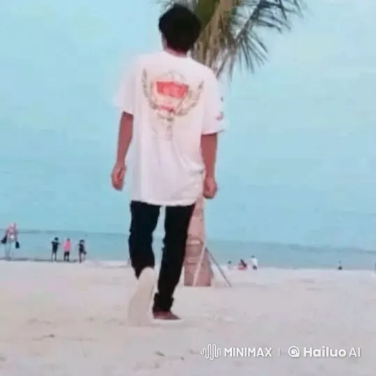 Young Man Walks to Serene Beach with Gentle Waves – AI Generated Video | Hailuo AI