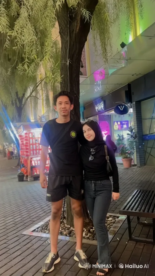 Young Couple Demonstrates Kung Fu in Lively Street Setting – AI Generated Video | Hailuo AI