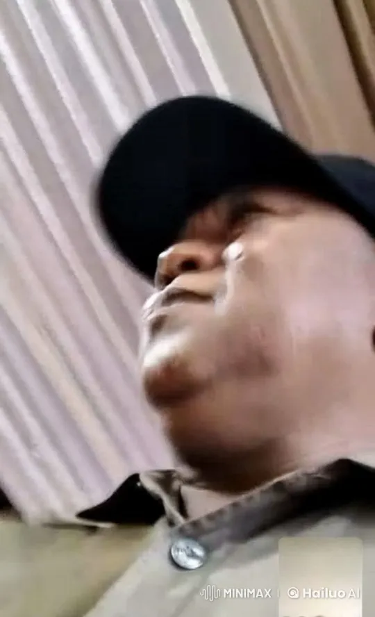 Person in Black Cap and Beige Coat: Indoor Serenity Video – AI Generated Video | Hailuo AI
