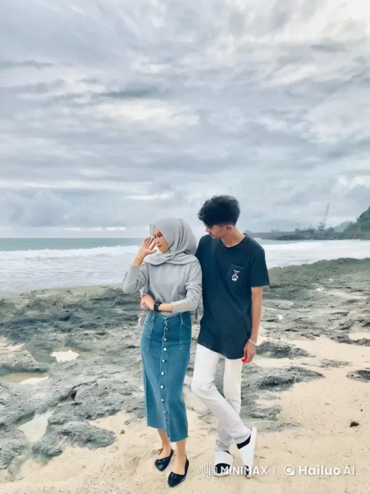 Couple on Beach with Industrial Shoreline Background – AI Generated Video | Hailuo AI
