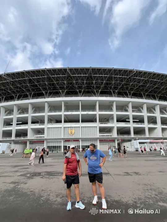 Stadium Scene: Two Men Chat as Clouds Shift – AI Generated Video | Hailuo AI