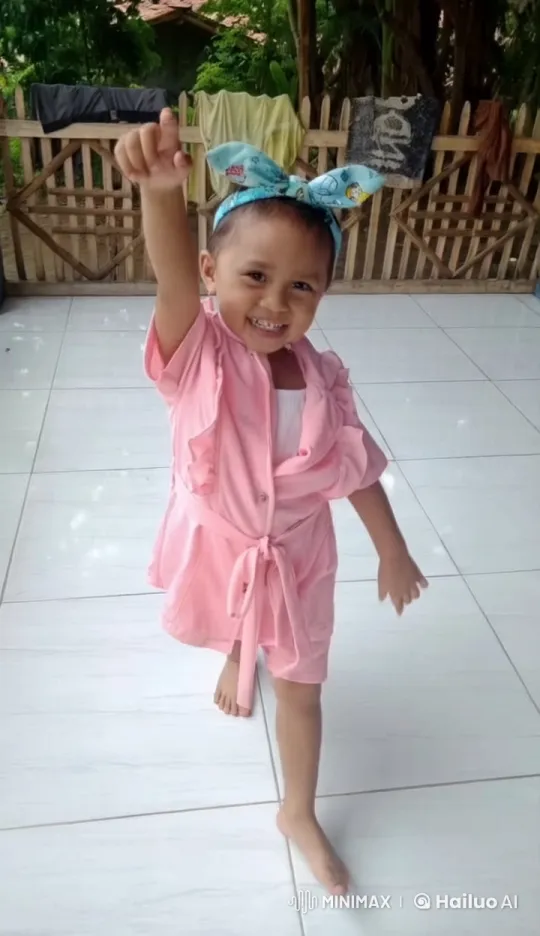 Child in Pink Outfit Performs Graceful Kungfu Pose – AI Generated Video | Hailuo AI