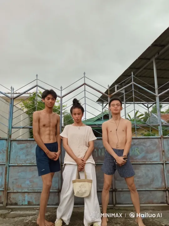 Three Individuals at Metal Gate in Gentle Breeze – AI Generated Video | Hailuo AI