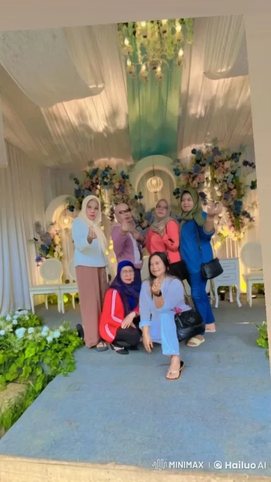 Group Poses Playfully on Florally Decorated Stage – AI Generated Video | Hailuo AI