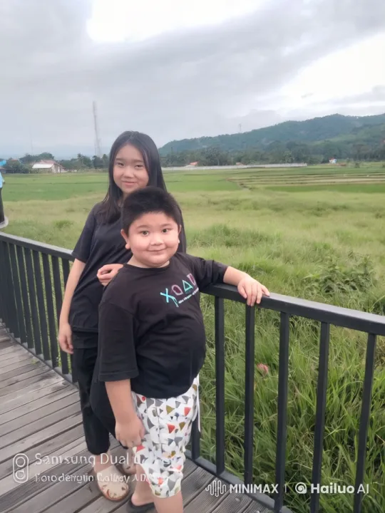 Children's Playful Kungfu Battle on Bridge with Scenic View – AI Generated Video | Hailuo AI