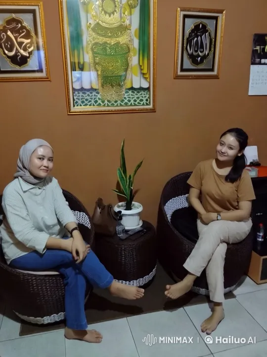 Two Women Chat in Cozy Room with Islamic Decor – AI Generated Video | Hailuo AI