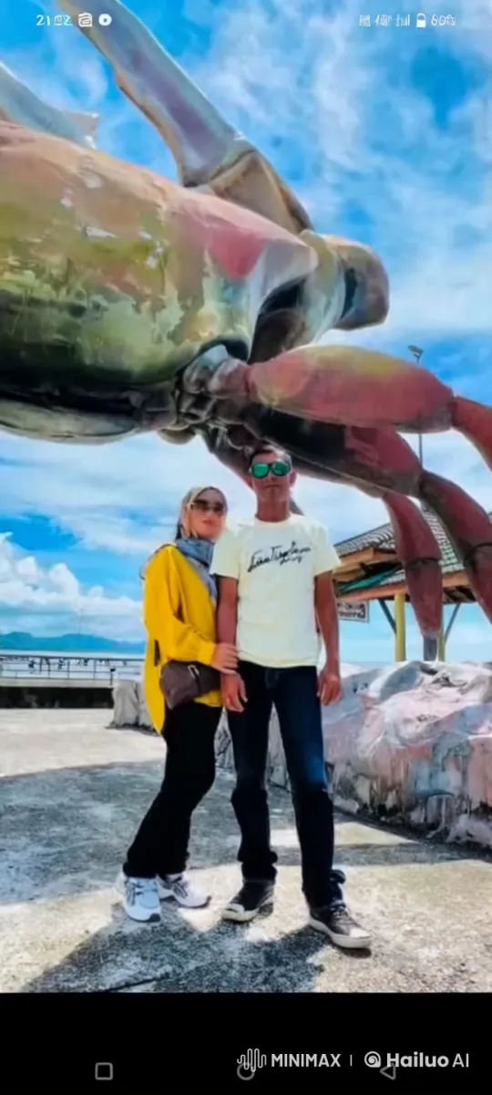 Couple Practices Martial Arts in Front of Giant Crab Sculpture – AI Generated Video | Hailuo AI