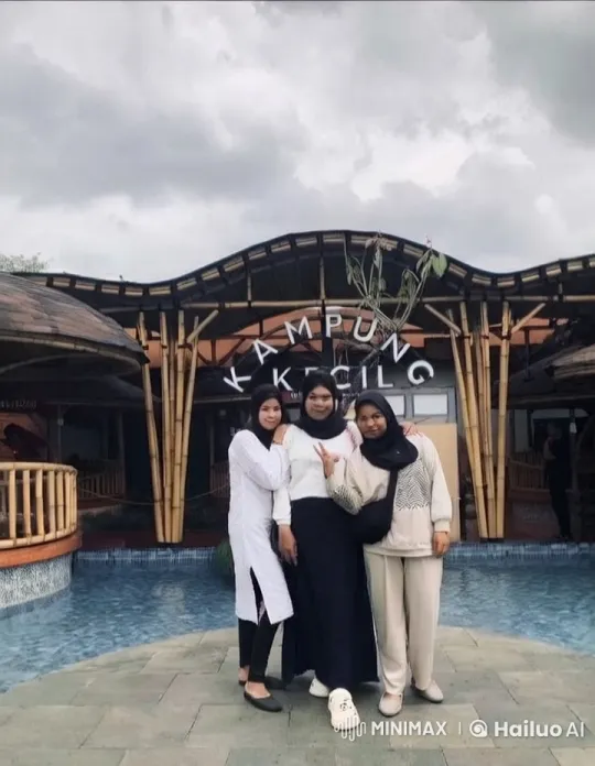 Friends Pose in Front of 'Kampung Kecil' Building – AI Generated Video | Hailuo AI