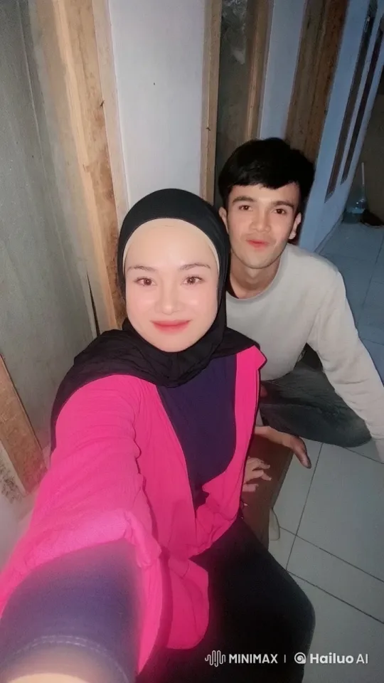 Woman and Man Taking Selfie in Indoor Setting – AI Generated Video | Hailuo AI