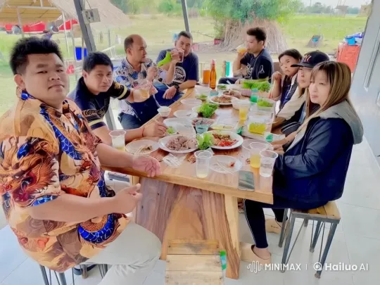 Group Enjoying Outdoor Feast at Rustic Table – AI Generated Video | Hailuo AI
