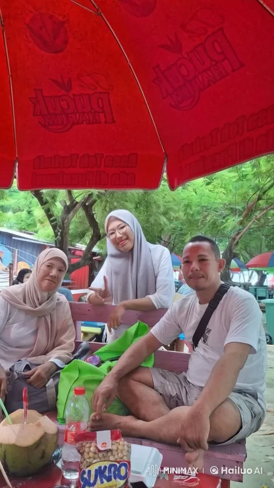 Friends Relaxing Under a Red Umbrella in Nature – AI Generated Video | Hailuo AI
