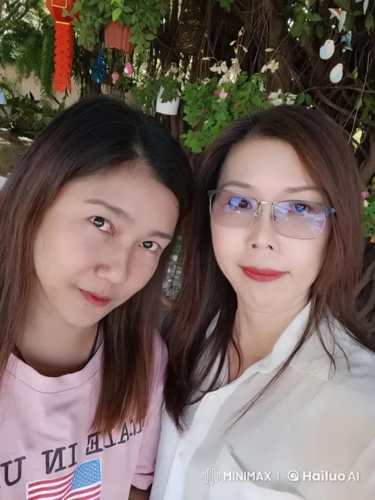 Two Friends Taking a Selfie in a Lush Garden – AI Generated Video | Hailuo AI