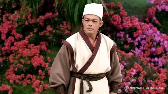 Traditional Fighter Showcases Skill Against Floral Backdrop – AI Generated Video | Hailuo AI