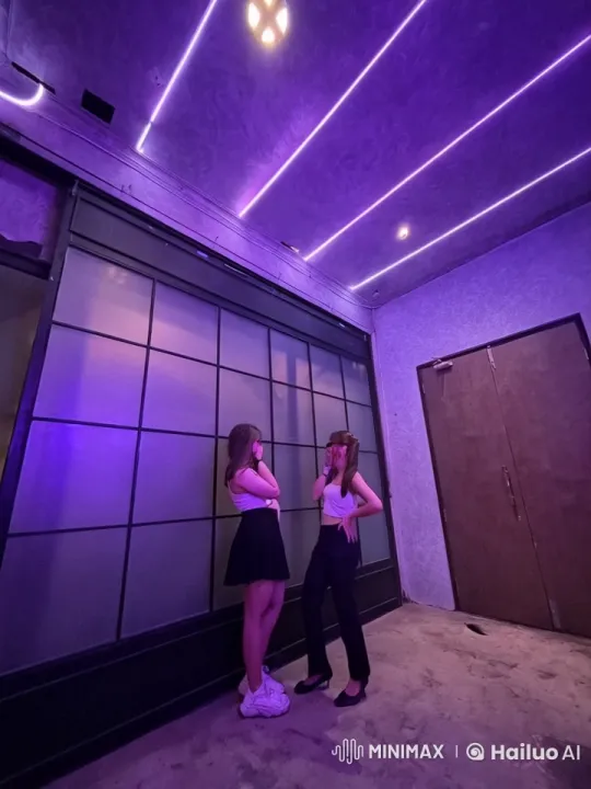 Women Prepare for Kung Fu Duel in Purple-Lit Room – AI Generated Video | Hailuo AI
