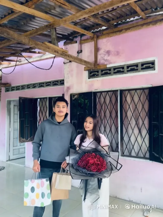 Couple Displaying Kungfu Skills in Front of Pink House – AI Generated Video | Hailuo AI