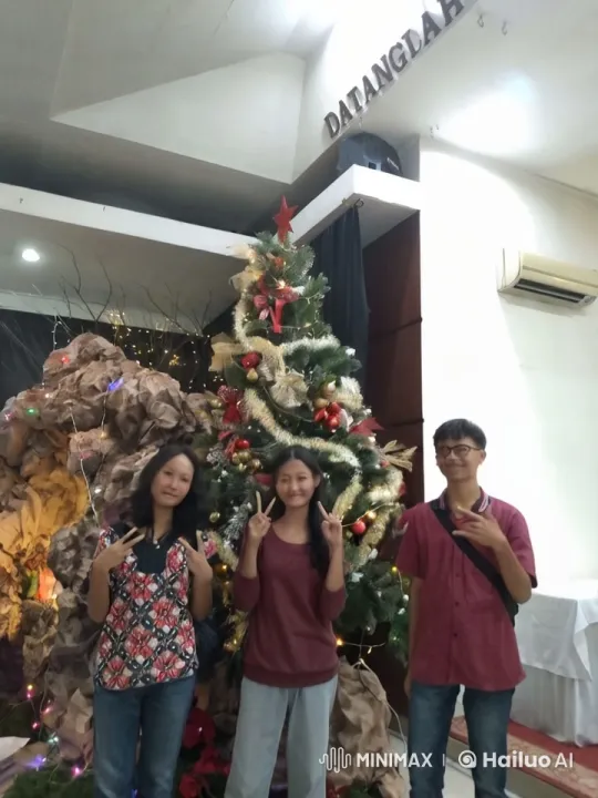Christmas Celebration: Individuals Jump and Kick in Front of Decorated Tree – AI Generated Video | Hailuo AI