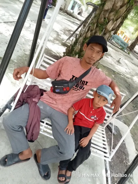 Father and Child Relax on Swing in Shaded Park – AI Generated Video | Hailuo AI