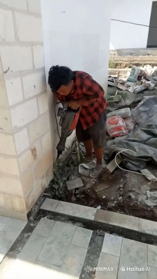 Construction Worker Operating Jackhammer at Building Site – AI Generated Video | Hailuo AI