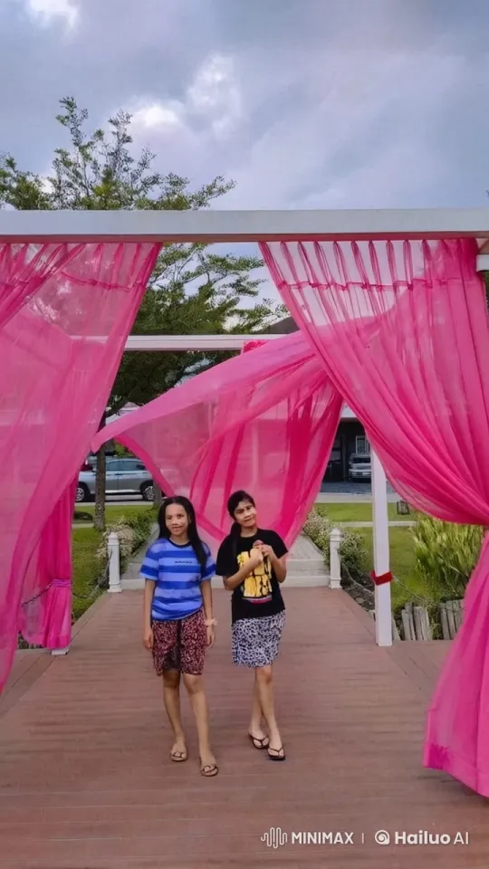 Kids' Playful Kung Fu Fight Under Pink Arch – AI Generated Video | Hailuo AI