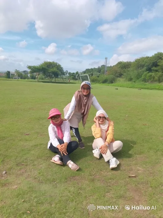Three Friends Joyfully Spar in Colorful Hijabs in Scenic Park – AI Generated Video | Hailuo AI