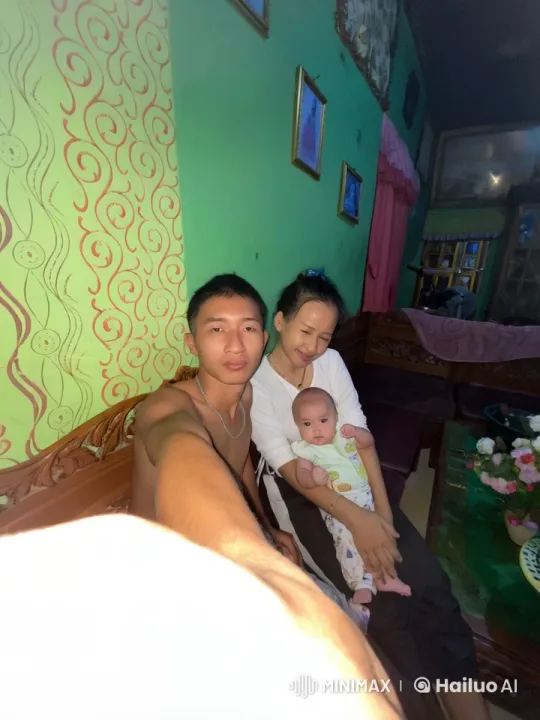 Shirtless Man Demonstrates Kungfu to Woman and Baby – AI Generated Video | Hailuo AI