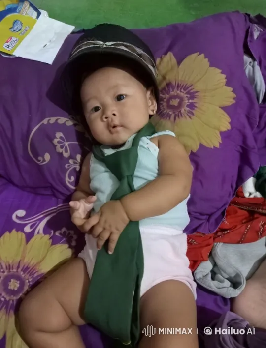 Baby Mimics Martial Arts on Colorful Bed – AI Generated Video | Hailuo AI