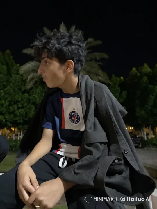 Young Person Smoking in Park at Night – AI Generated Video | Hailuo AI