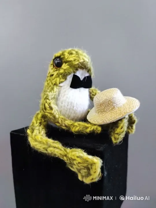 Frog Toy Presents Hat on Pedestal – AI Generated Video | Hailuo AI