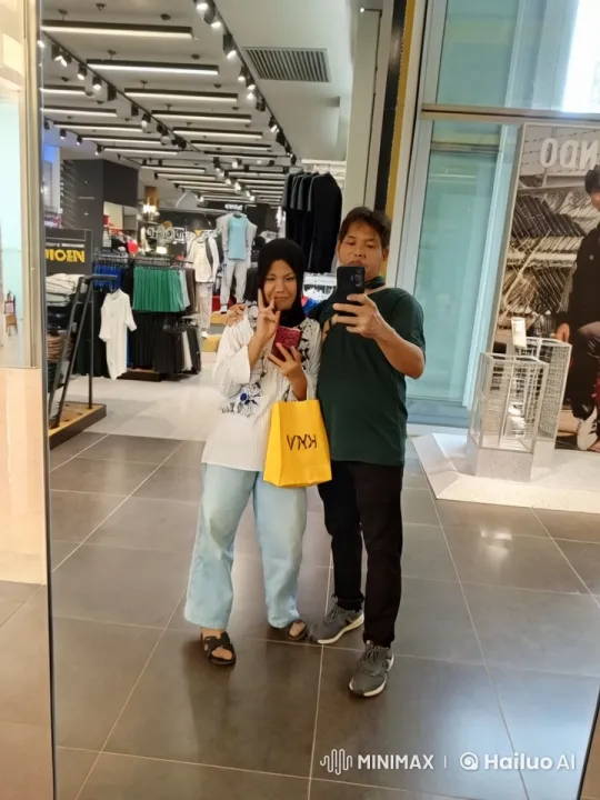 Couple's Kungfu Mirror Selfie in Clothing Store – AI Generated Video | Hailuo AI