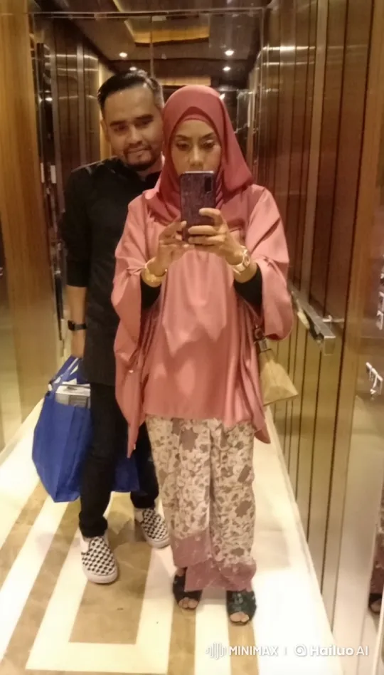 Woman in Hijab and Man Practice Martial Arts in Elevator – AI Generated Video | Hailuo AI