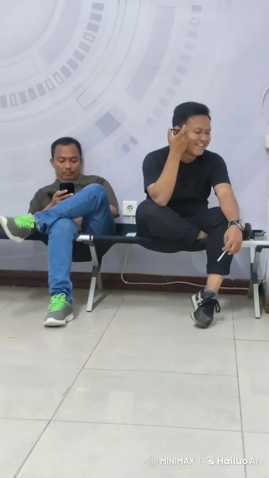 Two Individuals on a Bench: One on Smartphone, Other Smoking and Talking – AI Generated Video | Hailuo AI
