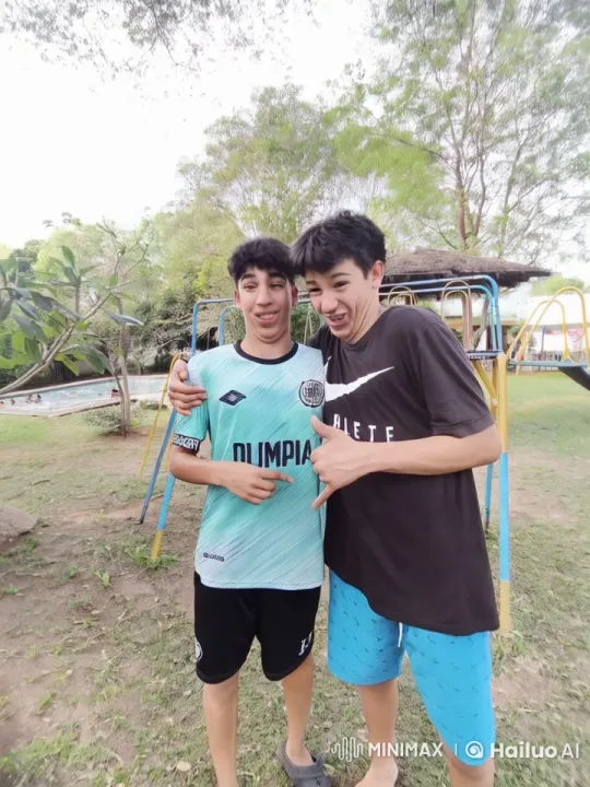 Boys Share Affectionate Moment in Park Loop Video – AI Generated Video | Hailuo AI