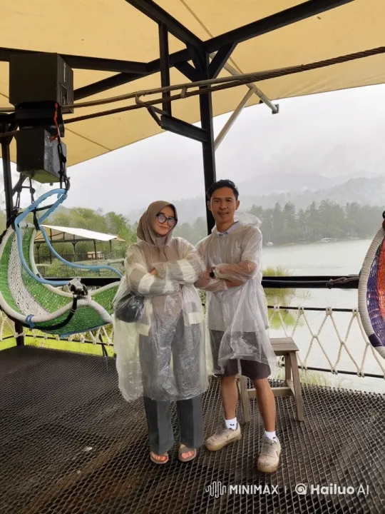 Playful Sparring Under Rain Ponchos at Scenic Lake – AI Generated Video | Hailuo AI