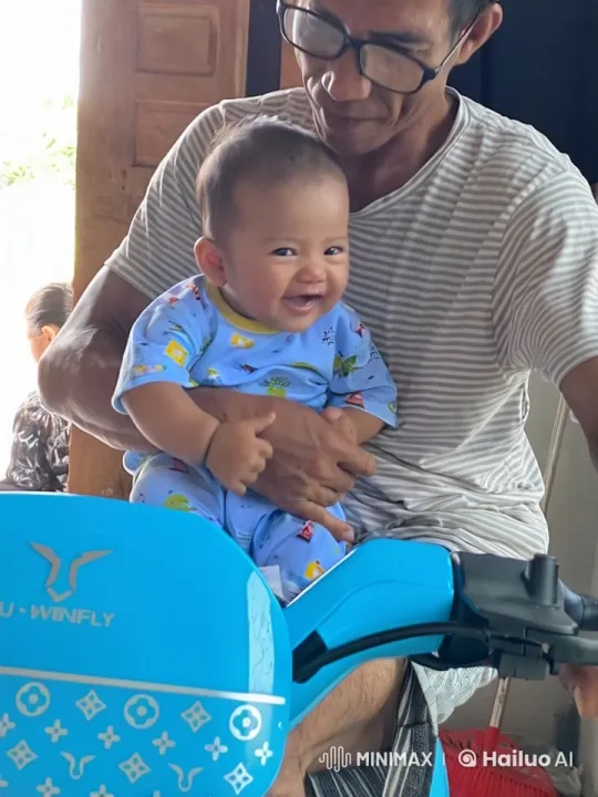 Baby Mimics Kungfu on Scooter with Adult Support – AI Generated Video | Hailuo AI