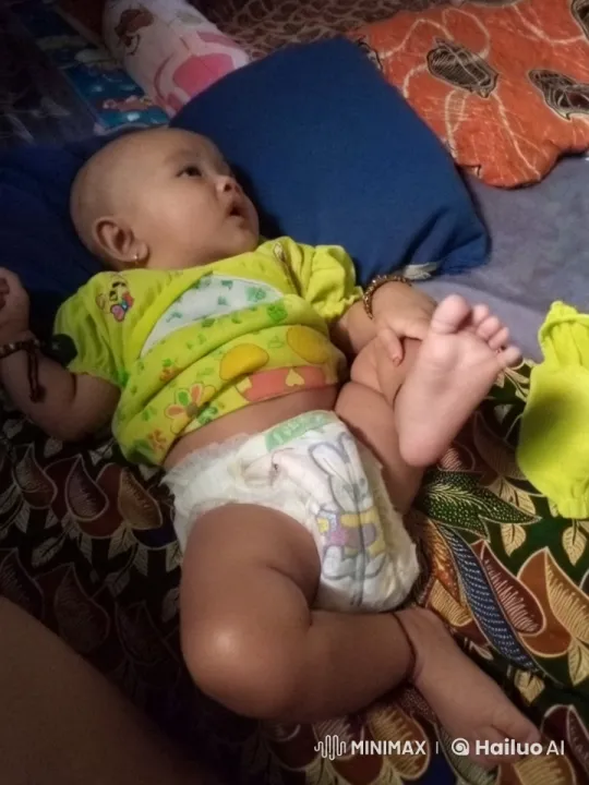 Baby's Playful Movements on Patterned Bed – AI Generated Video | Hailuo AI