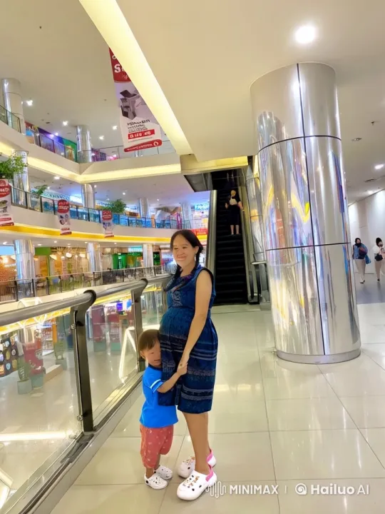 Pregnant Woman and Child Enjoy Playful Kung Fu in Mall – AI Generated Video | Hailuo AI